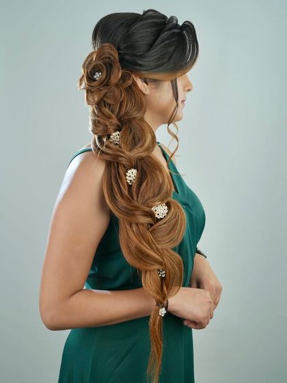 The full profile of this elaborate braided hairstyle, demonstrating the skills our students acquire in our 18-day intensive course.