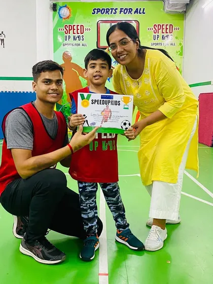 Another shot of Yuvaan proudly displaying his certificate. We are so proud of his progress.