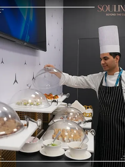 Our chef overseeing the buffet at a corporate pavilion, ensuring every dish is perfectly presented. We maintain the highest standards of quality and service throughout any event.