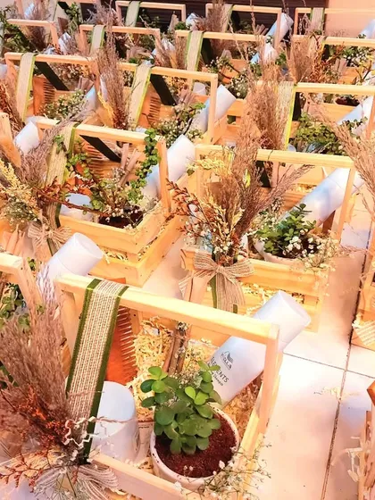 A PR gift hamper designed for Wella's eco-friendly product range. To align with the sustainable theme, we included a bamboo comb and a live jade plant along with their products in a rustic wooden crate.
