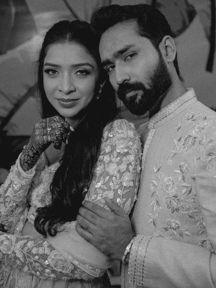 An intimate black and white close-up, capturing a moment of quiet connection and love.