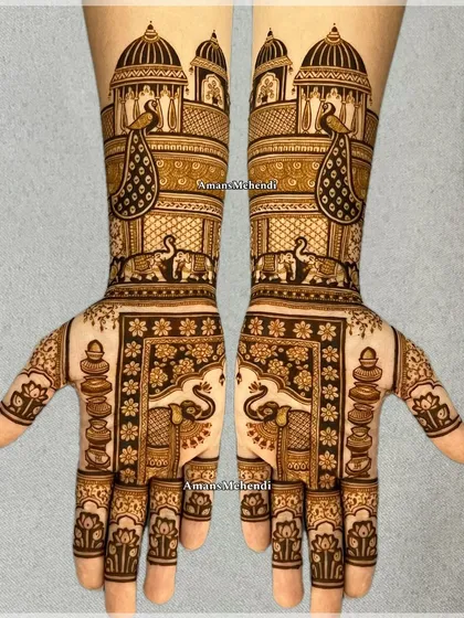 A stunning example of symmetrical bridal art, with palace scenes, peacocks, and elephants creating a royal theme across both hands.