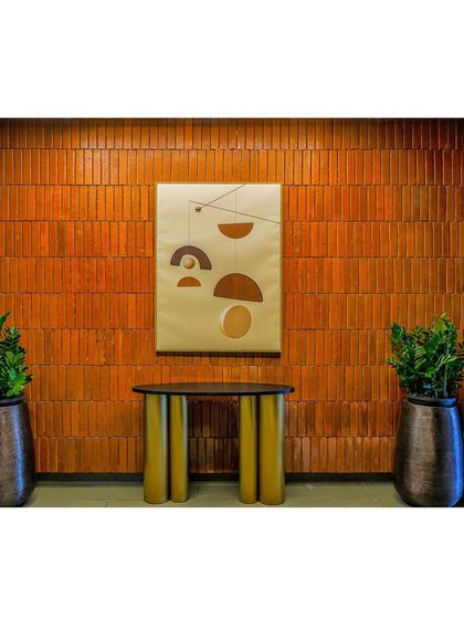 A duplicate image of the console table and brick wall, highlighting the rich texture and color.