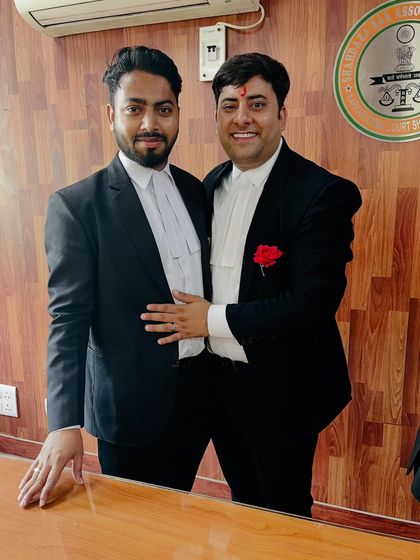 A moment of camaraderie and celebration with a colleague.