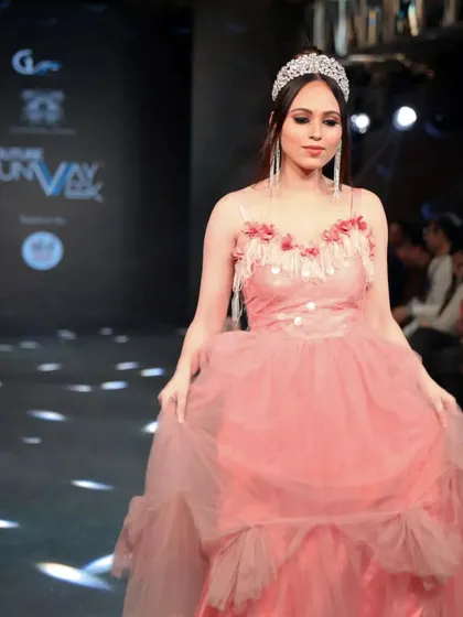 A closer look at the show opener, model Anshika. I styled her in a tiara and long, sparkling earrings to complement the delicate floral details on the neckline of her pink gown for Couture Runway Week.