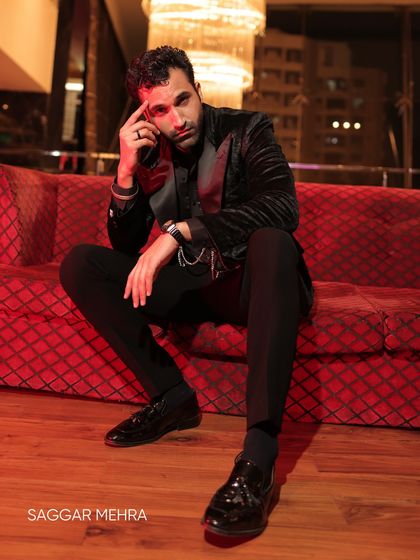 A candid shot of Gurfateh Pirzada in our black velvet couture. The jacket's texture and fit are designed to make a statement, reflecting a mood of quiet power and refined style.
