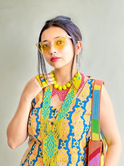 Another portrait, showing how all the colorful accessories come together to create a cohesive and fun look.