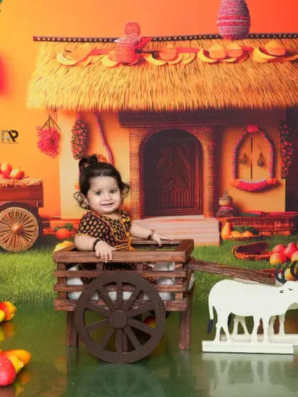 Another perspective of the rustic farm theme, showing the baby happily sitting in the cart. This theme is a wonderful way to create a unique and story-like portrait.
