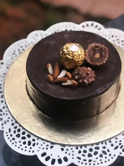 Everyone deserves a delicious slice of cake. This is my gluten-free ragi chocolate cake, a surprisingly rich and moist creation that even skeptics love. It’s finished with a smooth chocolate ganache and decorated with Ferrero Rocher and almonds.