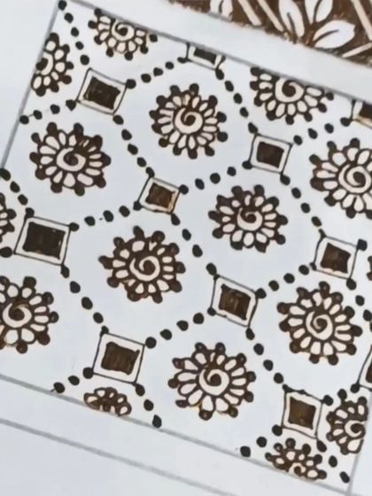 Another look at the spiral flower and dot grid. Consistency in size and spacing is key, and I'll teach you how to achieve it.