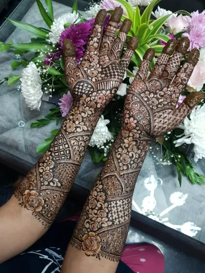 Another shot of the same design, with a focus on the delicate rose motifs near the wrist.