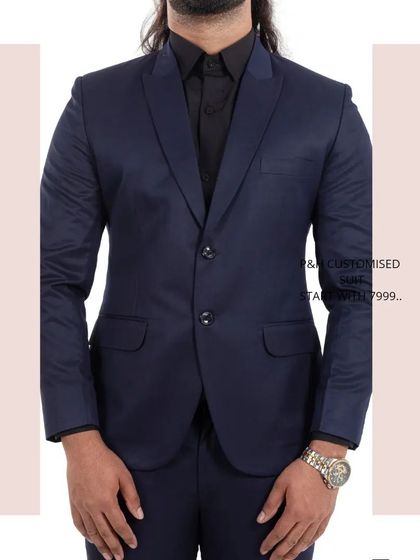 A close-up torso shot of the navy blue suit, focusing on the jacket's details and fabric.