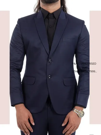A close-up of the navy blue suit jacket, focusing on its classic design and fabric.