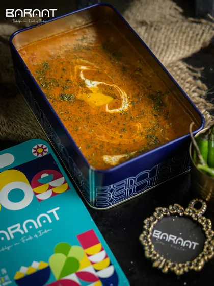 Our signature Dal Baraat, a richer and creamier version of Dal Makhni, is slow-cooked for hours to achieve its distinctive velvety texture. It arrives in our beautiful, reusable tin box, ensuring it's hot, fresh, and spill-proof.