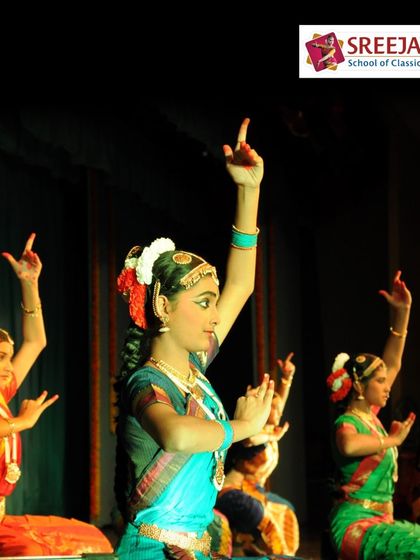 A group of my students in a moment of graceful stillness on stage. Their focus and dedication are evident in their perfect posture and alignment.