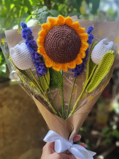 Why choose one when you can have them all? This handmade crochet bouquet features a bright sunflower, elegant white tulips, and fragrant lavender sticks, all wrapped up and ready to gift.