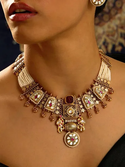 A close-up of the heritage-style necklace, showcasing the intricate details and craftsmanship that go into each piece.