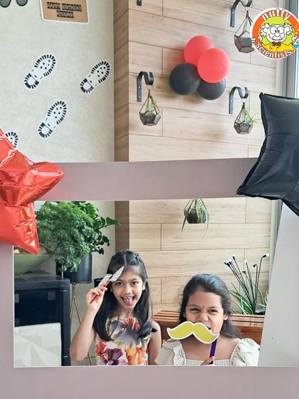 These two detectives are ready to interrogate the suspects. The photo booth props add an extra layer of fun and imagination to the CSI themed party experience.