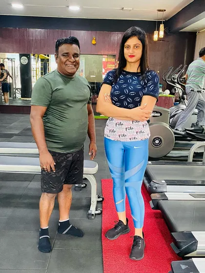 Standing strong with a client. My goal is to empower everyone who walks through the door.