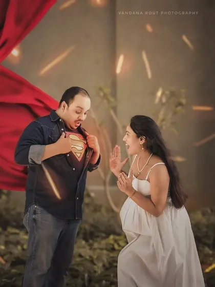 A fun and creative "Super Dad" themed shot, showing a playful interaction between the expecting couple. Your maternity session should reflect your unique personality.
