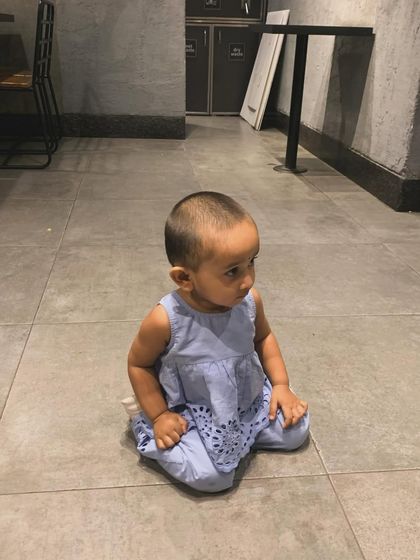 My daughter sitting on the floor, looking adorable. This was another shot from my collaboration with Firstcry for their big sale.