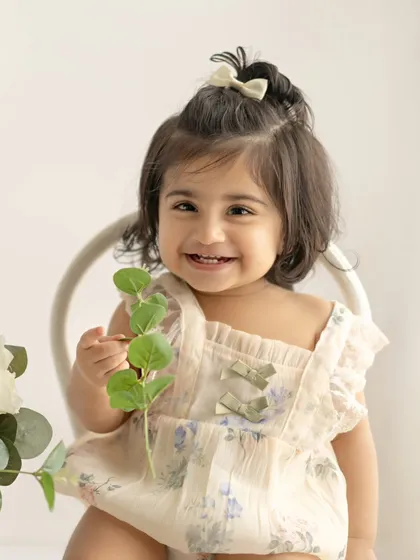 A sweet smile from this little model during her sitter session.