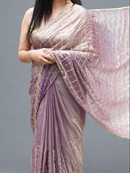 A mid-drape shot of the lavender organza tissue saree, showing how beautifully the fabric falls and catches the light.
