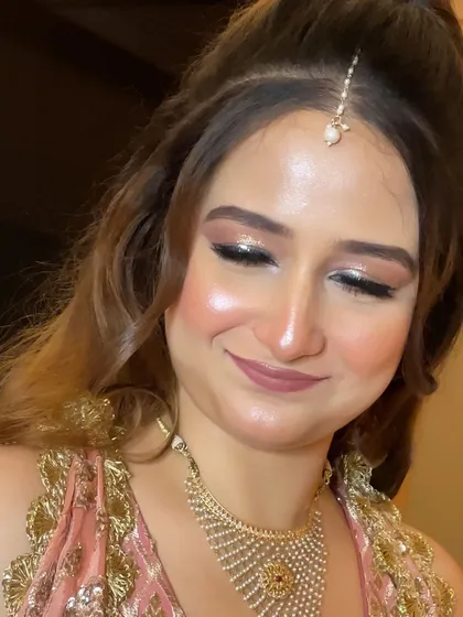 A detailed close-up of the makeup, showing the flawless base and soft, blended eyeshadow.