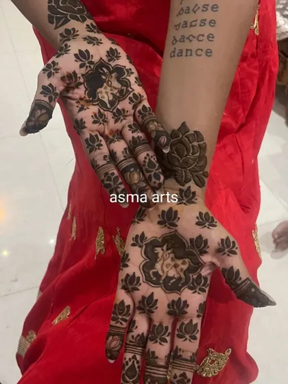 Mehendi can be modern too. This design uses negative space and bold lotus motifs to create a contemporary yet elegant look, perfect for someone wanting a unique style.
