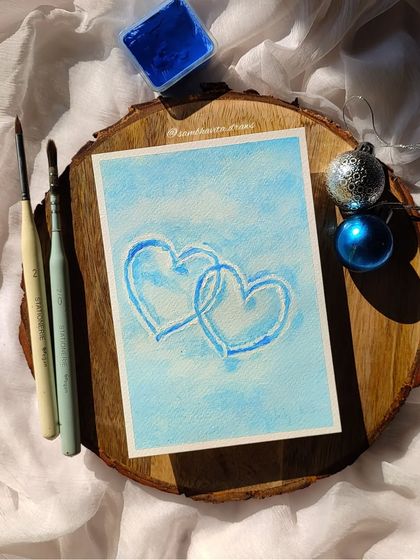 I painted these simple, snowy hearts with blue gouache on a light blue background. It's a sweet and frosty piece that's perfect for winter.