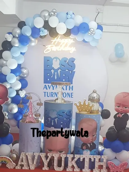 A Boss Baby theme with a large backdrop and themed pedestals. The blue, white, and black color scheme is sharp and stylish.