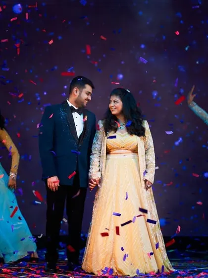 The final pose of a couple's dance, surrounded by confetti and their dance troupe. We plan for picture-perfect endings.