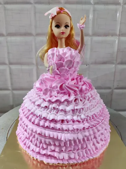 Another one of my popular doll cake designs. This one features a full pink ruffled buttercream gown, perfect for a princess-themed party.