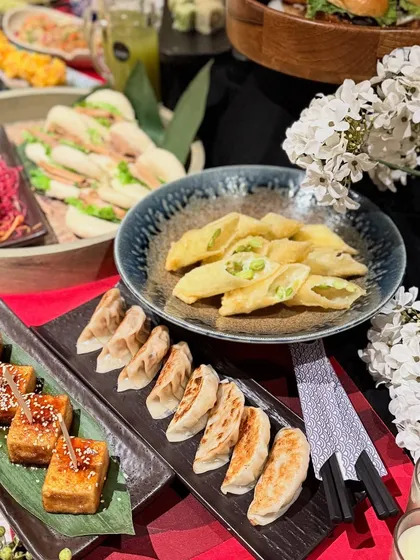 A close-up of some of our most popular catering appetizers. Here you can see our pan-fried Gyoza, savory Agedashi Tofu, and delicate spring rolls, perfect for guests to enjoy as they mingle.