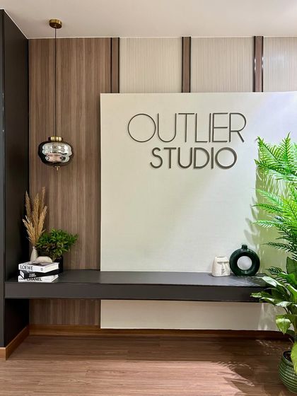 Our studio space is designed to inspire creativity. The clean lines, natural wood tones, and greenery reflect the same design principles I apply to my clients' homes.