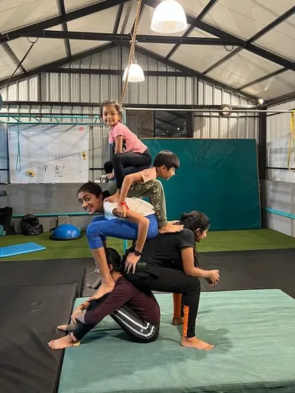 Teamwork makes the dream work. My kids' gymnastics classes are all about building skills together, like this multi-person human pyramid that requires balance, strength, and communication.