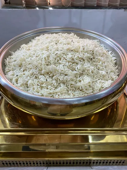 A large serving of fluffy Jeera Rice, tempered with cumin seeds.