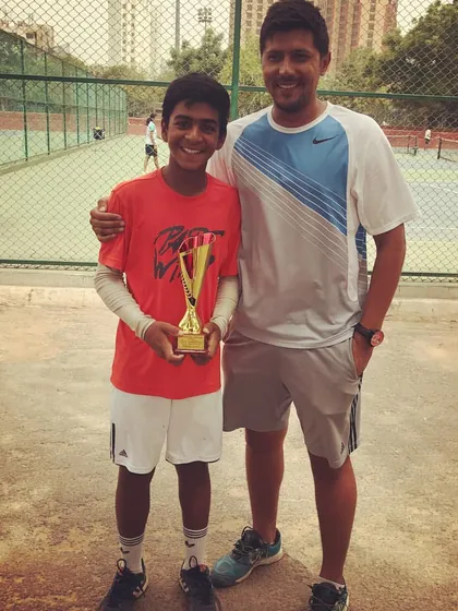 The champion of the All India Tennis Association (AITA) Boys Under 14 tournament poses with his trophy. Hosting AITA events is a core part of our service, offering young players a chance to earn national ranking points.