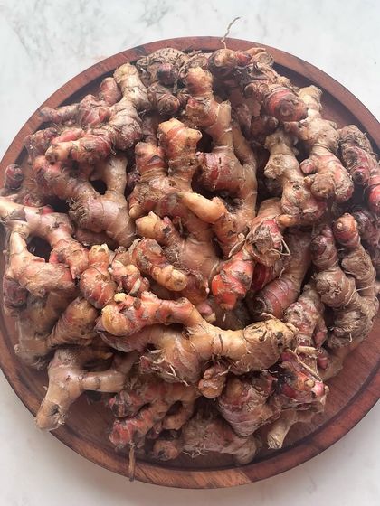 A pile of local red ginger, one of my favorite ingredients. It has a more intense and aromatic flavor than regular ginger, adding a special warmth to our curries.