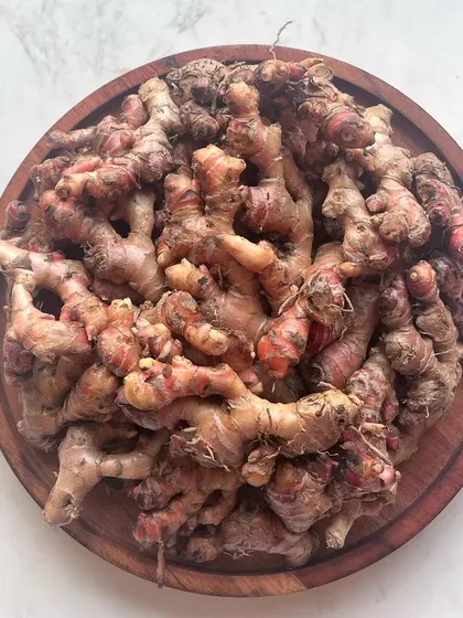 A pile of local red ginger, one of my favorite ingredients. It has a more intense and aromatic flavor than regular ginger, adding a special warmth to our curries.