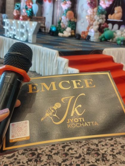 My mic and my notes, ready to go. The stage is set for a beautiful baby shower, and I am prepared to make it a day to remember.