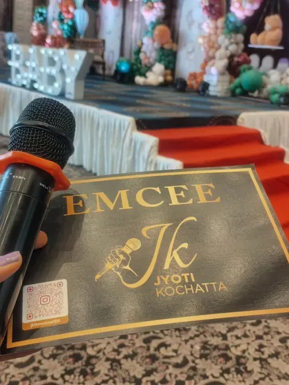 My mic and my notes, ready to go. The stage is set for a beautiful baby shower, and I am prepared to make it a day to remember.
