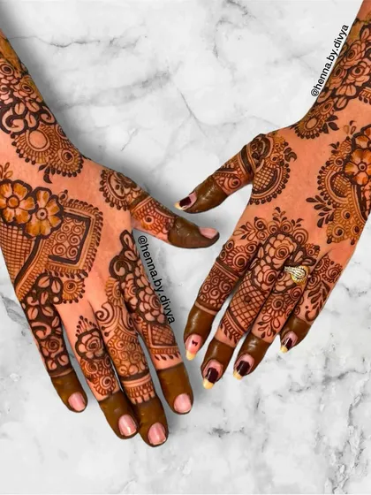 I call this my designer Indo-Western mehendi. It combines various elements like florals, paisleys, and geometric shapes in a non-symmetrical layout for a truly unique and artistic statement.
