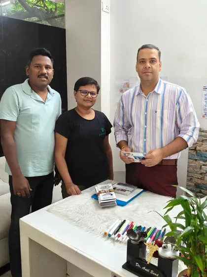 Posing with Dr. Anil Sood and his colleague at our facility. I believe in working with other health experts to provide a comprehensive wellness journey for my clients, combining therapies for the best results.