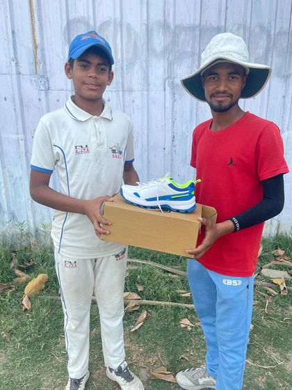 Mohit Vats being awarded for his excellent bowling performance in the tournament.