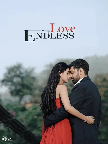 An intimate portrait of a couple in a loving embrace on the bridge, with the misty mountain background adding to the romantic atmosphere.
