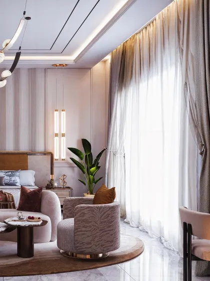 This angle emphasizes the natural light from the large window, with sheer curtains diffusing it softly across the room.