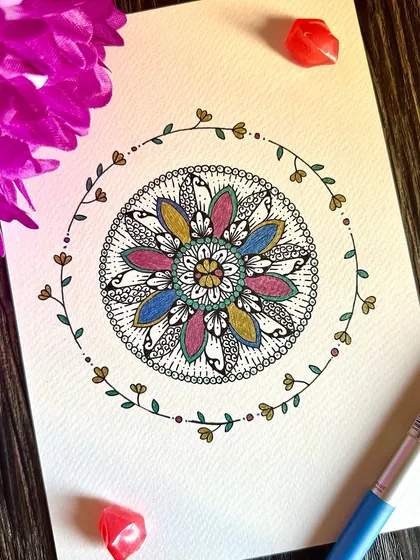 This floral mandala is surrounded by a delicate, hand-drawn vine. The soft colors and nature-inspired elements combine to create a piece that feels like a gentle breath of fresh air.