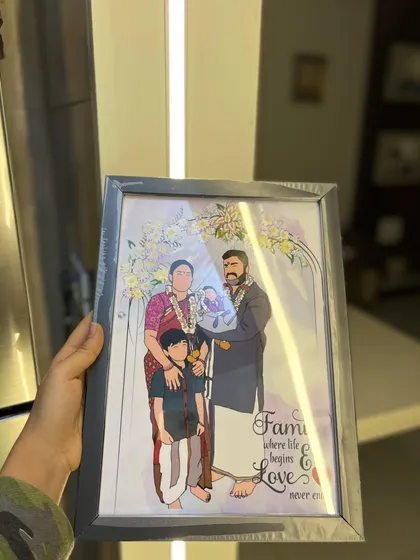 This family portrait illustration is extra special, showing the addition of a new baby. The quote 'Family where life begins & Love never ends' adds a heartfelt touch to this custom piece, all set in a modern grey frame.