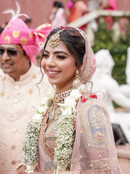 The joy of the wedding ceremony. Mahima's smile is infectious, and her soft pink pastel makeup look is fresh, youthful, and perfect for her.